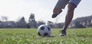 Kicking a football