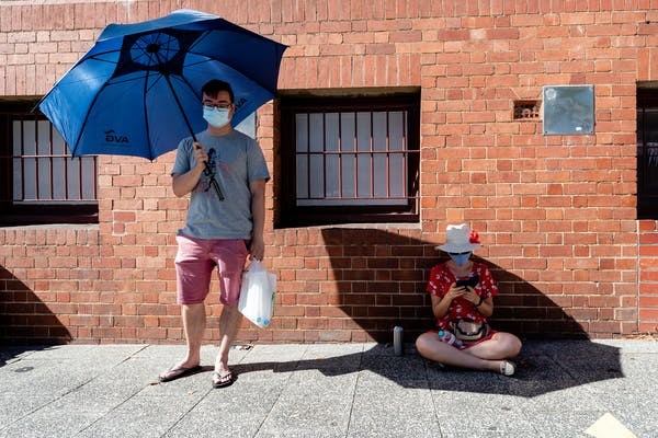 Two people waiting to take COVID-19 test