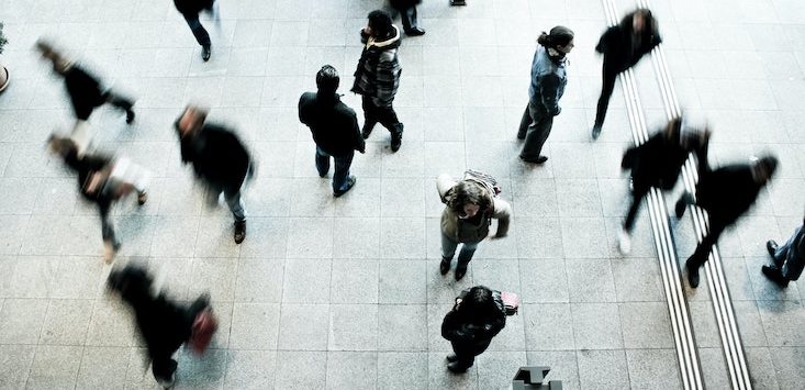 people on foot in transit in city