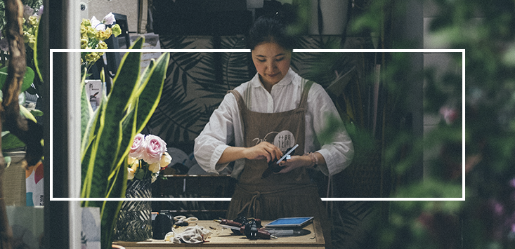 retail worker at shop front; Seek