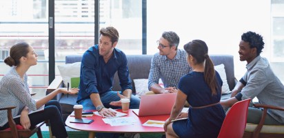 staff conversation in workplace seating area