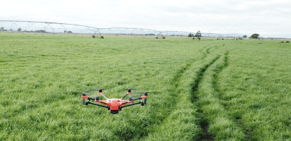 Farm Automation drone surveying grass paddock